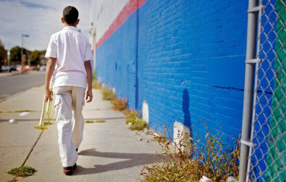 student carrying trumpet