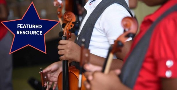 Students holding violins