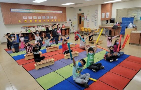 students playing boomwhackers