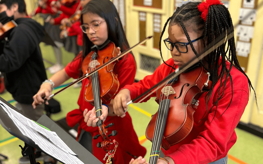 Students playing violins